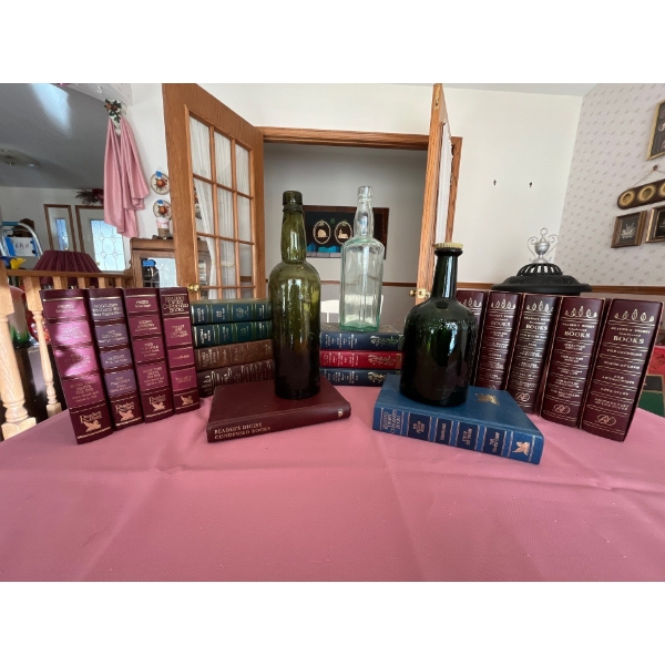 collection of vintage books and whiskey bottles.
Including a Green John Begg bottle