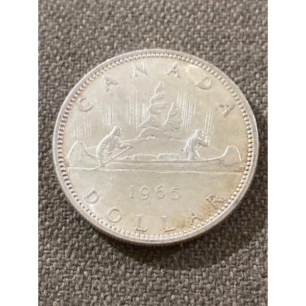 1965 Canadian Silver Dollar Coin Featuring Canoe Design