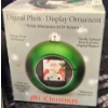 Image 4 : Kirkland Rotating Musical Snow Globe, Sitting Bear With Skates, and Digital Ornament Set