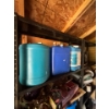 Image 2 : Two metal storage shelves with contents, 320 L water jugs, hammocks lights, tarps, glass carboys, an
