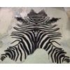 Image 1 : Cow fur area rug with zebra pattern (some discoloration) - 80W, 89T 