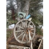 Image 2 : Large wagon wheel with yard signs large antique saw and two flower boxes.