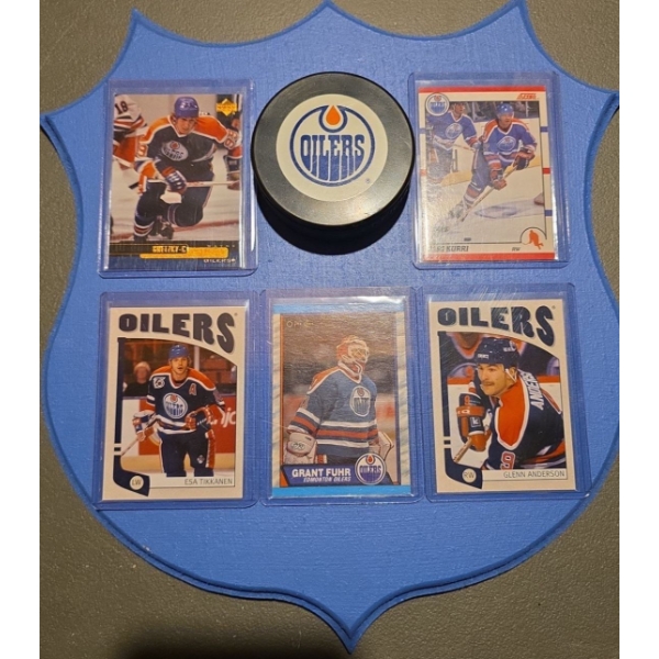 Display Plaque Featuring Edmonton Oilers Memorabilia including a Puck & Five Cards
