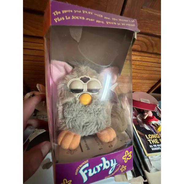This is a vintage Furby, an electronic robotic toy that was originally released in 1998 by Tiger Ele
