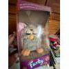 Image 1 : This is a vintage Furby, an electronic robotic toy that was originally released in 1998 by Tiger Ele