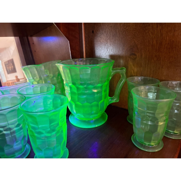 uranium glass juice jug and 6 tall glasses all in amazing condition green in color