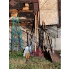 Image 1 : Garden supply lot, tomato’s cages, rakes shovels snippers and more