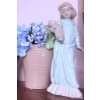 Image 1 : Decorative Lot Featuring Ceramic Figurine, Vases, and Pottery Pieces