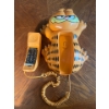 Image 2 : 1986 Garfield Wall Phone
Collection of vintage sports items juggling set rollerskates baseball mitts