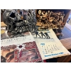 Image 1 : Skull bottle holder some piano keys, a vintage treasury branch wall calendar and the Polar Express g