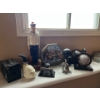 Antique sailor sculpture, pinhole, camera, collector tins, globe bookends, vintage bike-horn and an 