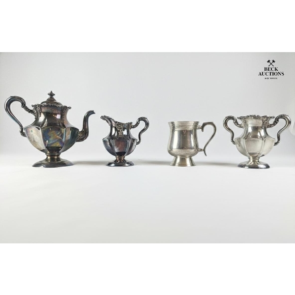 Vintage Silver-Plated Tea Set, A Teapot, Creamer, Sugar Bowl, And Another Vessel.
