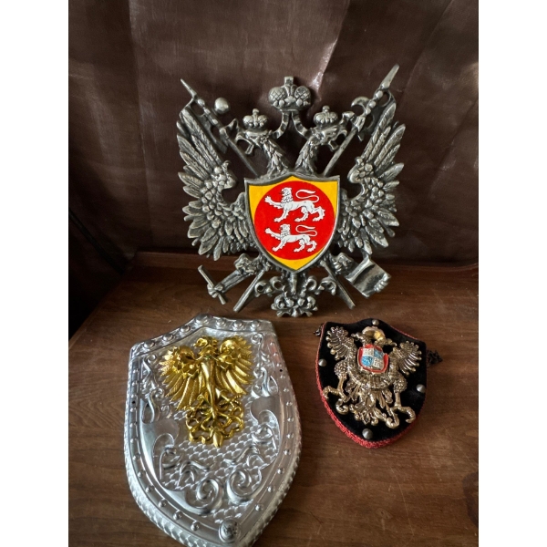 Crests Made of Brass, Plastic, and Wood