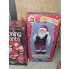 Image 4 : 4 Musical Animated Holiday Toys Including Santa, Snowman, and Motorcycle Toy