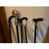 Image 3 : Selection of canes, a shoe rack, and jars of vintage buttons