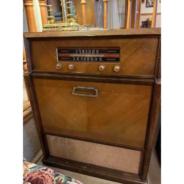 Standard broadcast radio, and record player with a great collection of original 8” records . 
