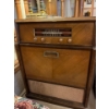 Image 1 : Standard broadcast radio, and record player with a great collection of original 8” records . 