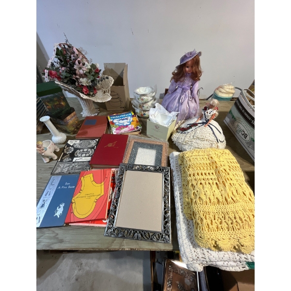 collection of crocheted, tablecloths frames, dolls with crochet dresses, kids books, knitting books 