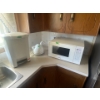 Image 1 : .Panasonic Microwave, Black and Decker Tea Kettle, Garbage Can.