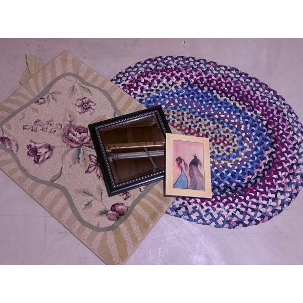 Decorative Lot Featuring Framed Mirror, Framed Artwork, Braided Rug, and Floral Mat