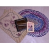 Image 1 : Decorative Lot Featuring Framed Mirror, Framed Artwork, Braided Rug, and Floral Mat