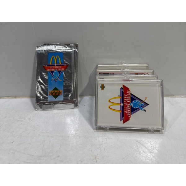 4 Plastic Cases and 5 Unopened Packs of McDonald All-Stars Hockey Cards