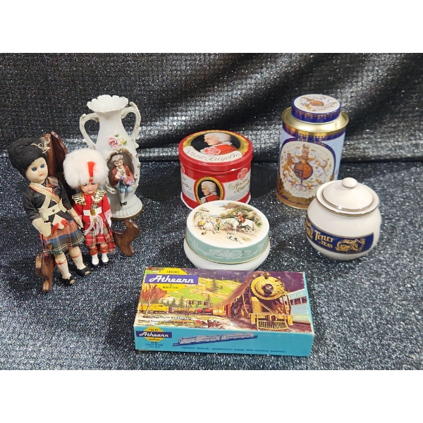 Two Scottish-Themed Porcelain Dolls & A Decorative Bud Vase With A Figurine Motif And More.