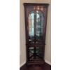 Image 1 : Cherry Oak Corner Curio Cabinet with Glass Shelves and Lighting