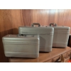 Image 1 : 3 Halliburton Aluminum Suitcases with Burgundy Interior