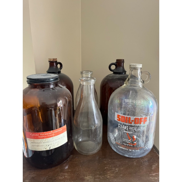 Collection of vintage brown jugs and one clear jug