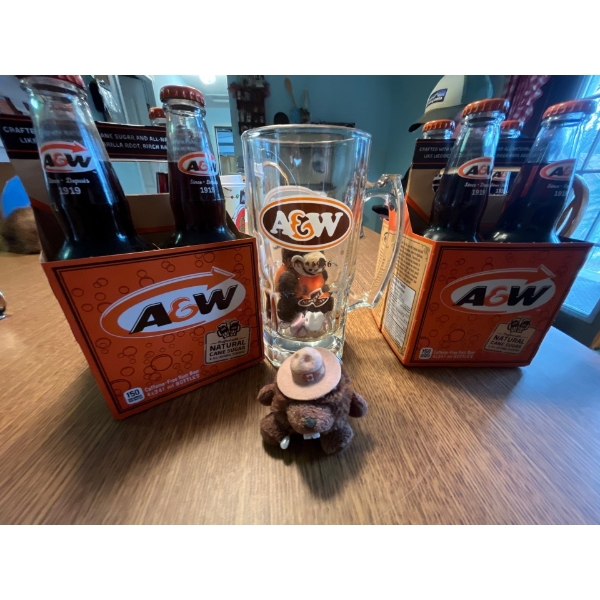 2 packs of A&W root beer along with A&W, large mug, and A&W bar great for the A&W collector