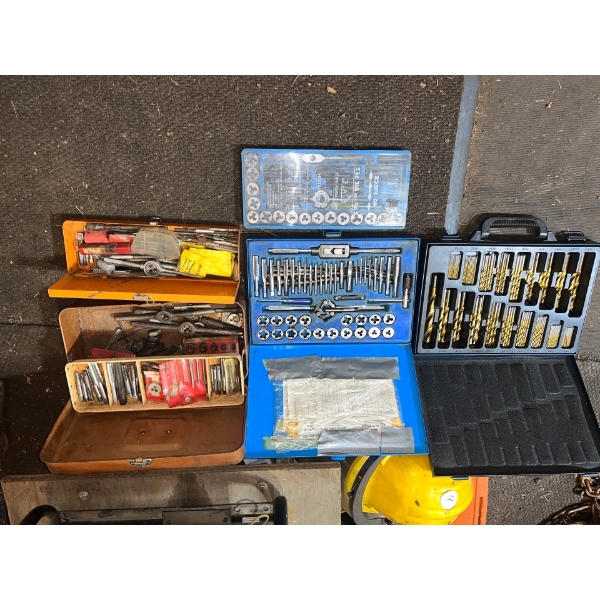  Large selection of tap and die sets as well as a full case drill bits.