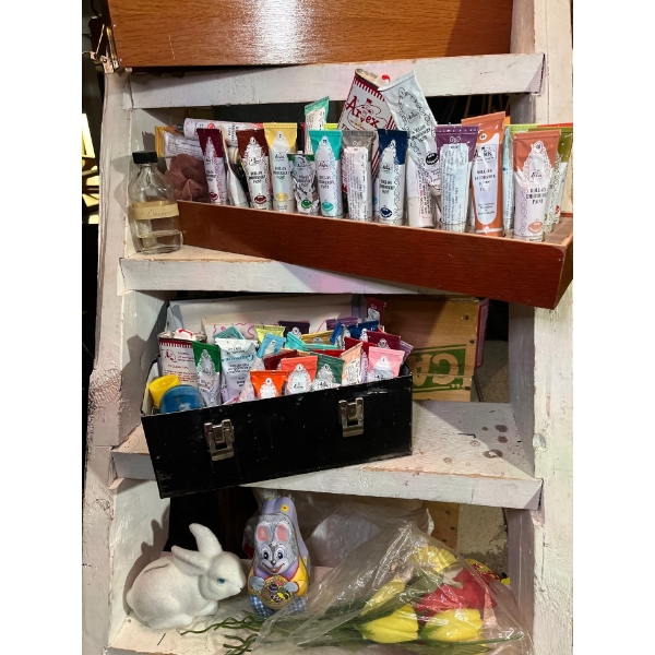 collection of artist paints in unique holders. Wooden crate box and metal lunch kit, with box of AVO