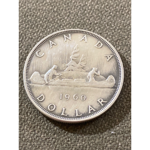1960 Canadian Silver Dollar Coin Featuring Voyageur Design
