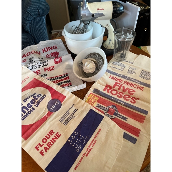 vintage sunbeam mixmaster with Pyrex bowls and two vintage flour sacks