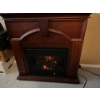 Dark, solid wood electric fireplace tested