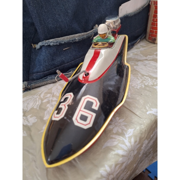 vintage tin lithographed speedboat made in Japan by Marusan in the 1950s or 1960s. 