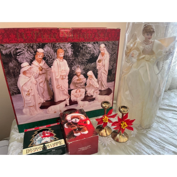 Of Christmas items, a large angel, brass candleholders, Coca-Cola decorative tree ornament, a porcel