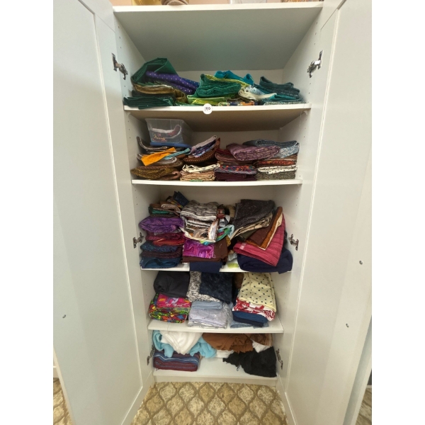  cupboard full of quilting fabric lots of greens and darker colours cabinet included