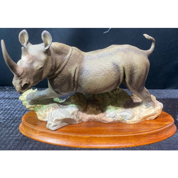 "African Thunder " Fine Porcelain Rhino on Wood Base