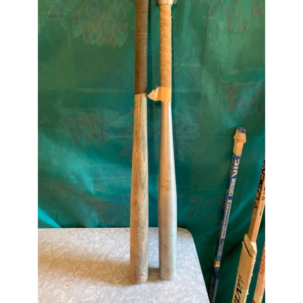 1970-1980 collection of made in Canada Goalie and Hockey Sticks with vintage baseball bats 