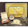 Image 1 : Decorative Clocks, Philishave Razor, and Peacock Artwork Display