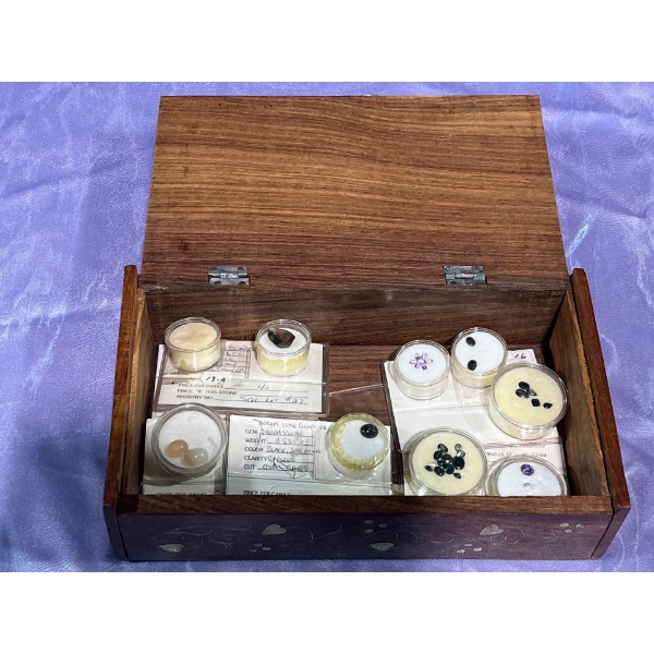 Collection of Unauthenticated Loose Gemstones in a Wooden Box