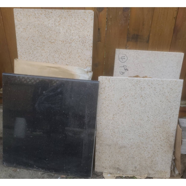 Granite Slabs – Polished Black and Speckled Light Stone