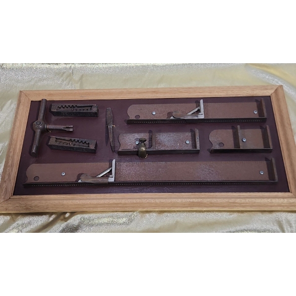 Vintage Hand Tools Displayed in Wooden Frame, Including Challenge "Hi Speed" Quoins