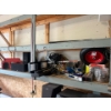 Image 2 : contents of shelf, including a GE garbage disposal, Kenwood speakers, rolling knee cart, laser level