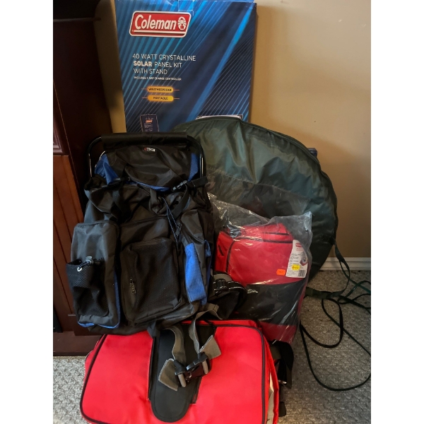 Selection of camping supplies, Coleman, solar, power, kit, backpacks, pop up tent, sleeping bag, and