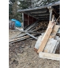 Image 1 :  large selection of usable, Barnwood plywood, and a massive stack of firewood. Buyer must take all