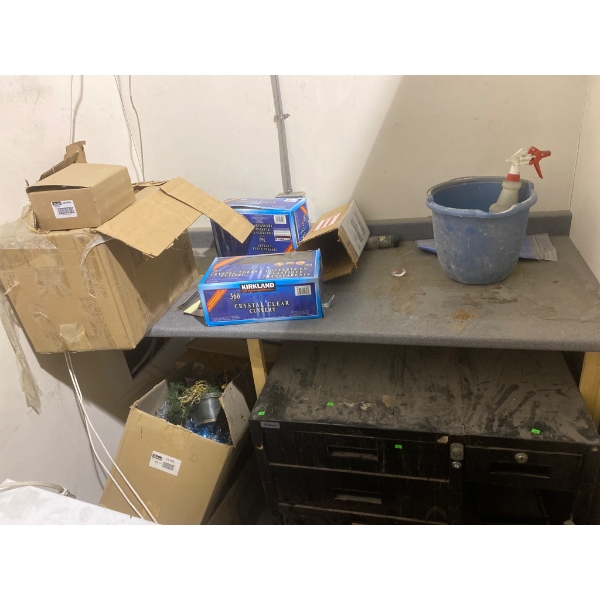 Shelf and Contents Including Cutlery Boxes, Decorations, and Cleaning Supplies