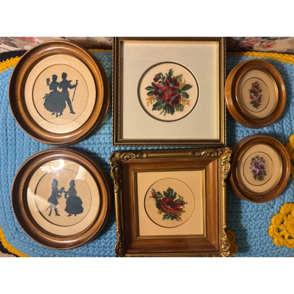 Antique collection of embroidered small framed pictures all in beautiful wood frames .